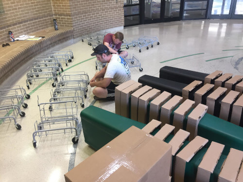 students putting together compost bins