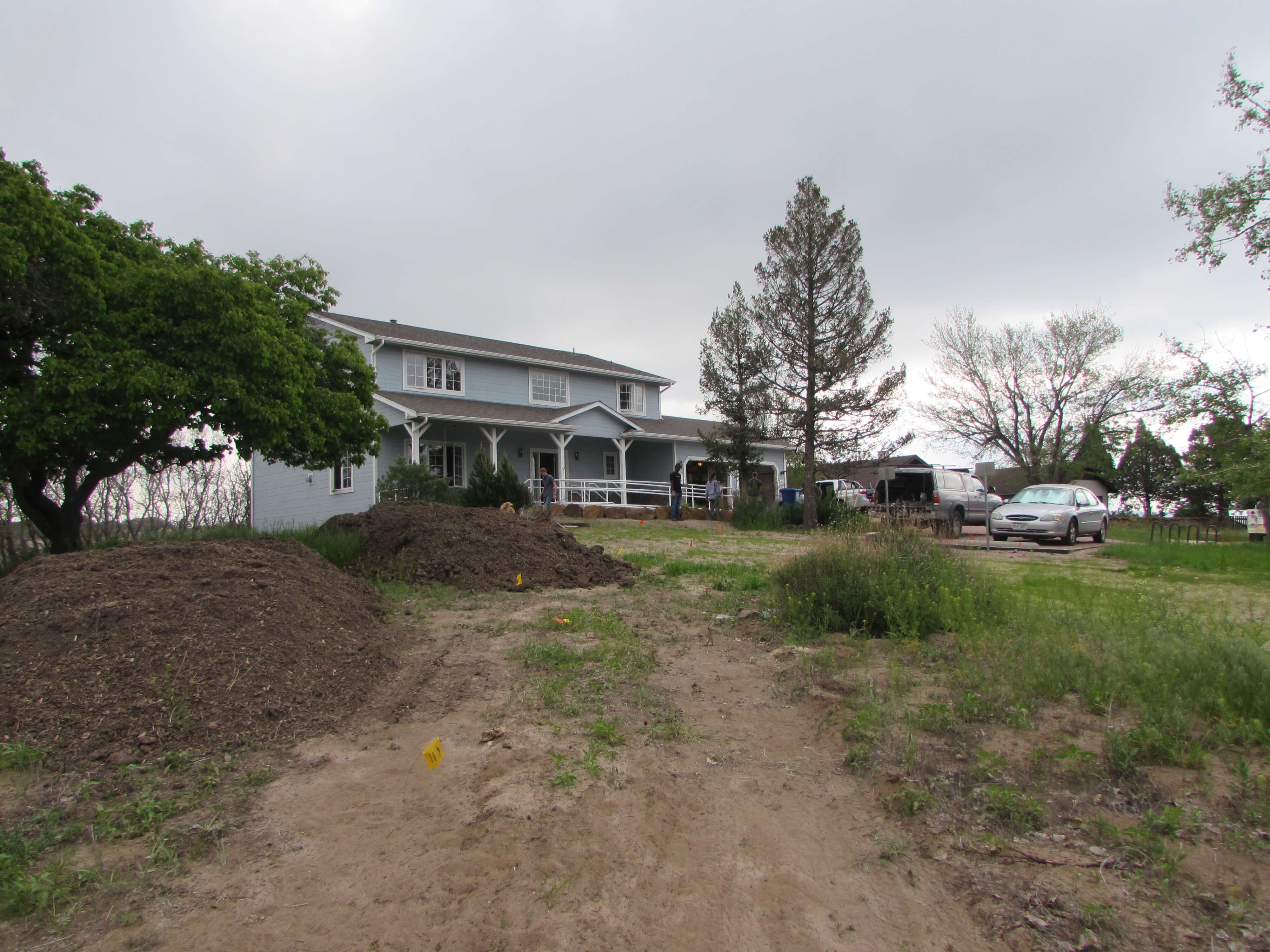 blue residential house with grass