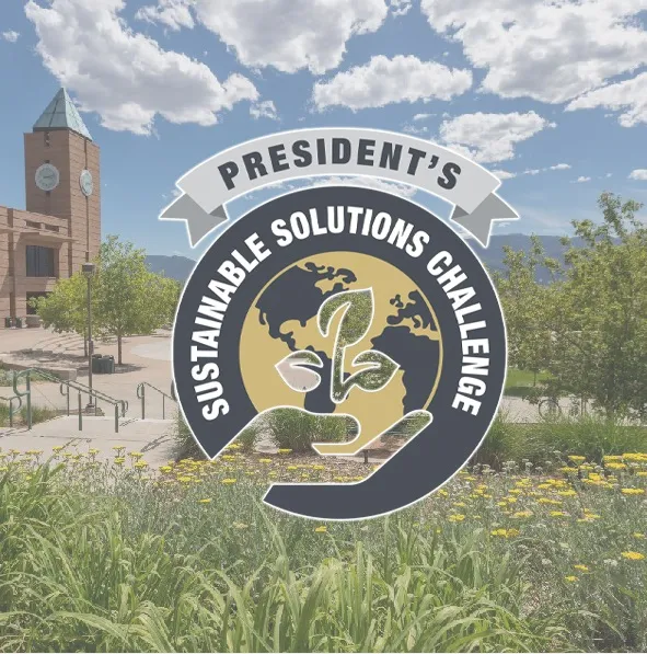 clock tower with sunny skies and plants in foreground