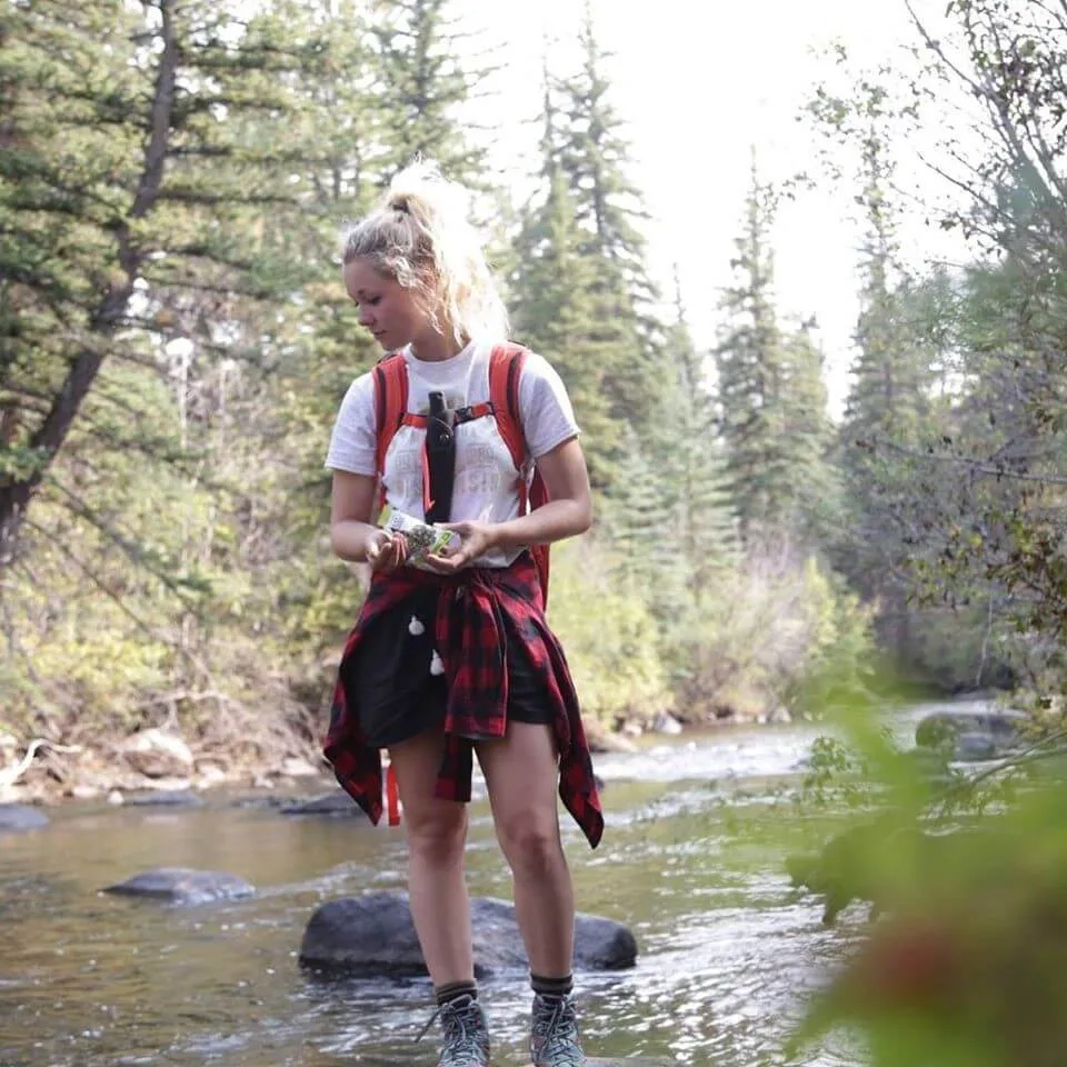 Jesse hiking near stream