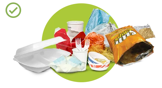 A mix of disposable items including wrappers, plastic cups, utensils, and food containers.